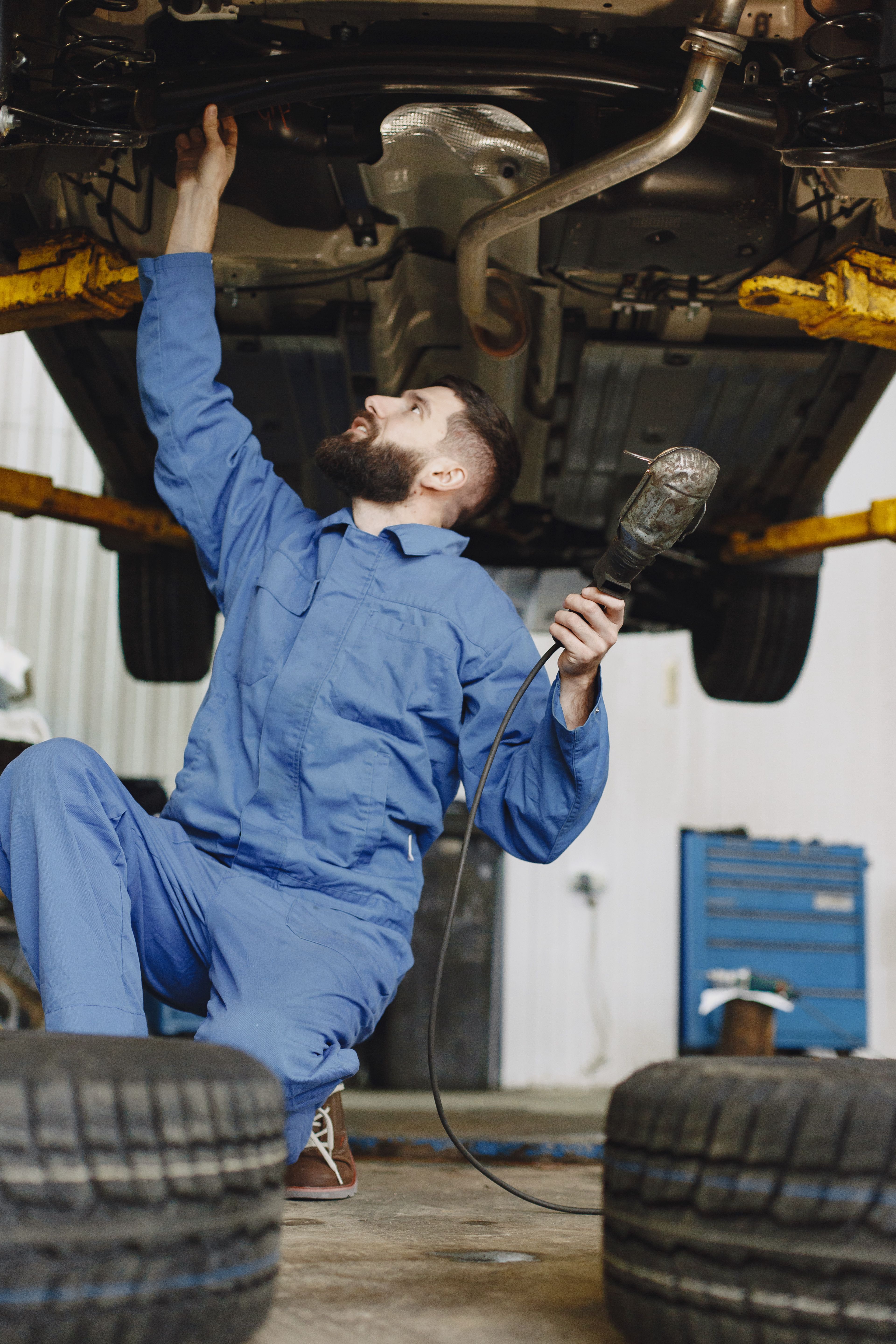 Professional auto technician working on vehicle